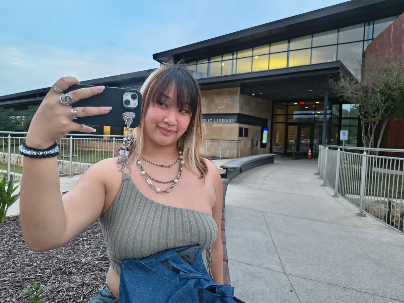 picture of a girl holding her phone to take a pic